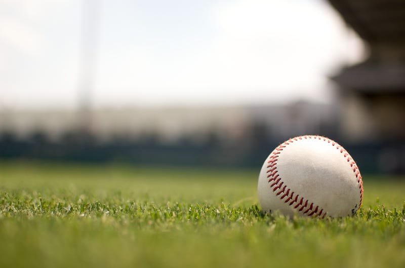 Baseball on grassy field