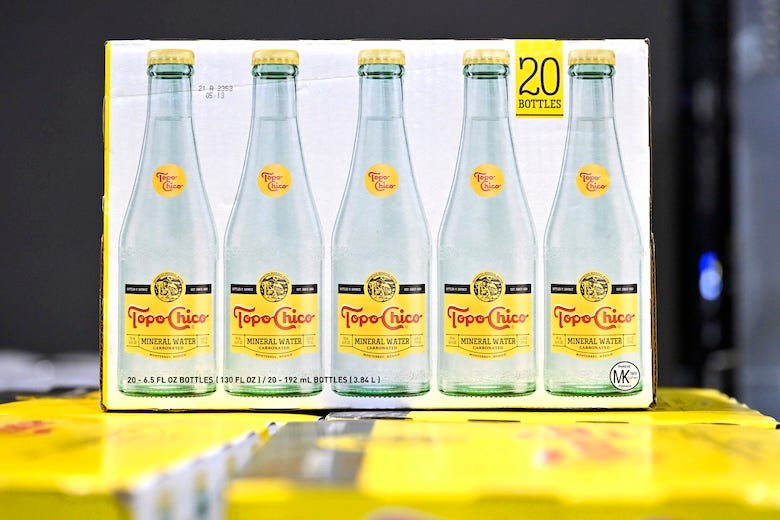 Case of Topo Chico on display