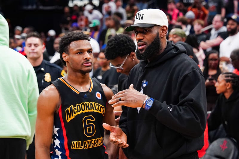 Bronny James #6 of the West team talks to Lebron James of the Los Angeles Lakers after the 2023 McDonald's High School Boys All-American Game at Toyota Center on March 28, 2023 in Houston, Texas. 