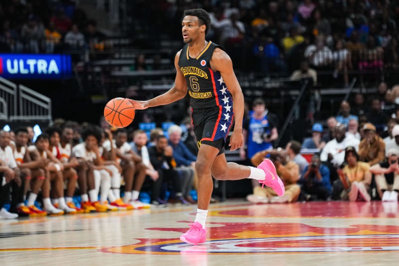 Bronny James #6 of the West team dribbles the ball during the 2023 McDonald's High School Boys All-American Game at Toyota Center on March 28, 2023 in Houston, Texas. 