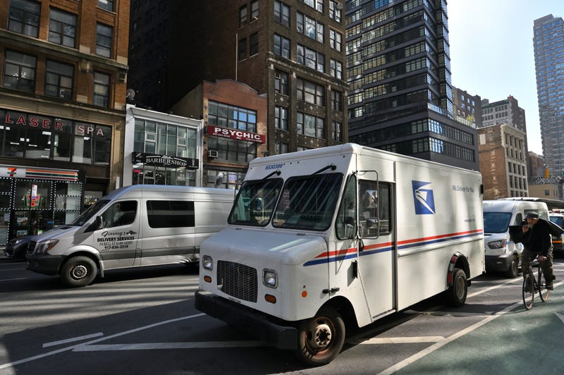 United States Postal Delivery truck parked on a street in Manhattan, New York, United States.