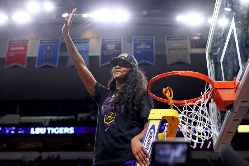 Angel Reese #10 of the LSU Lady Tigers cuts down a piece of the net after defeating the Iowa Hawkeyes 102-85 during the 2023 NCAA Women's Basketball Tournament championship game at American Airlines Center on April 02, 2023 in Dallas, Texas. (Photo by Maddie Meyer/Getty Images)