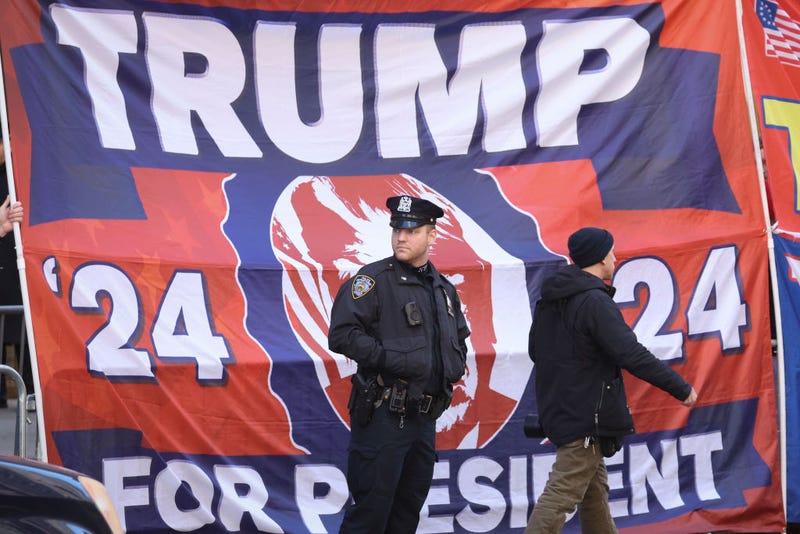 A member of the New York City Police Department stands post outside Trump Tower as crowds and media await the arrival of former U.S. President Donald Trump on April 3, 2023 in New York City.