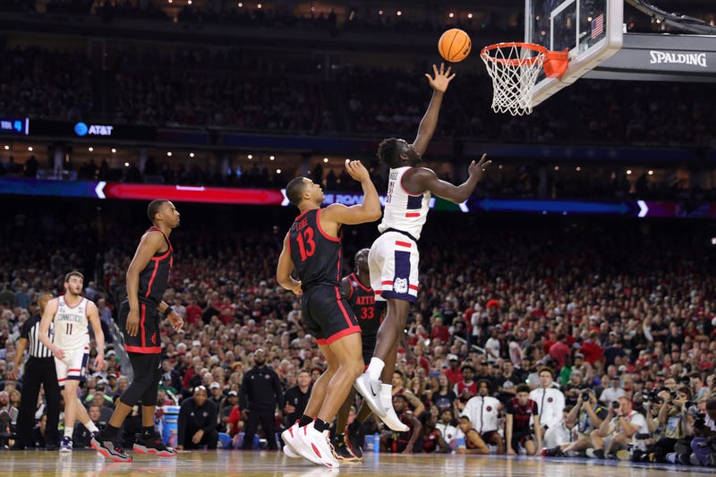 Adama Sanogo of UConn shoots the ball against the San Diego State Aztecs during the first half during the NCAA Men's Basketball Tournament National Championship in Houston, 4/3/23