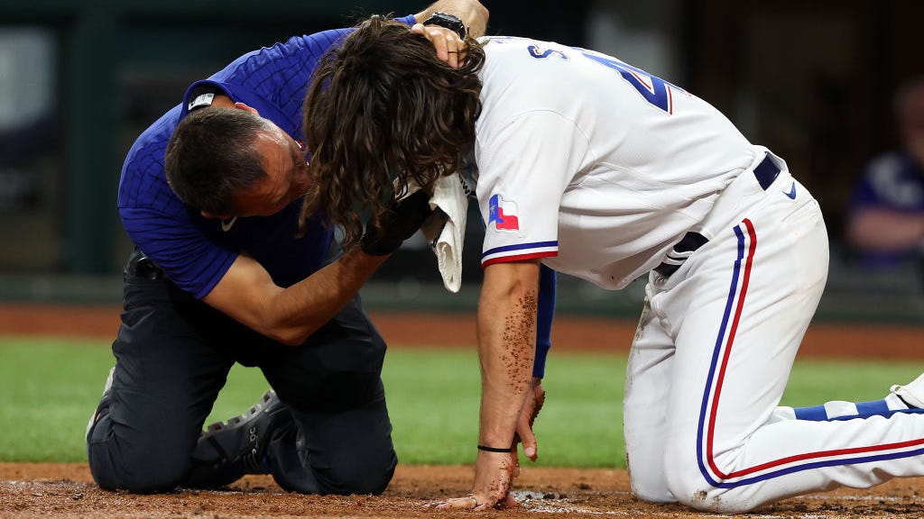 Rangers outfielder Josh Smith hit in the face by a fastball; undergoing tests