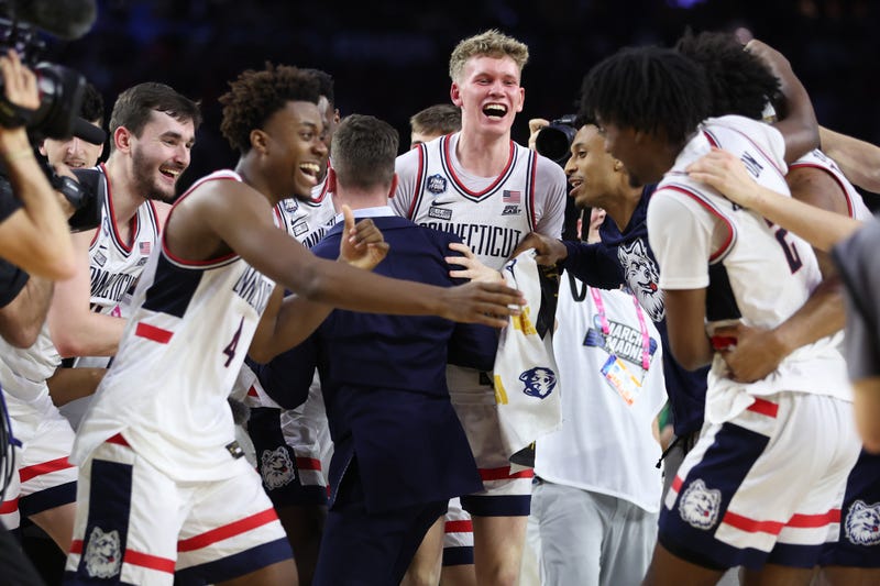 UConn's Nahiem Alleyne celebrates with teammates after defeating San Diego State for the NCAA championship on April 03, 2023 in Houston, Texas.