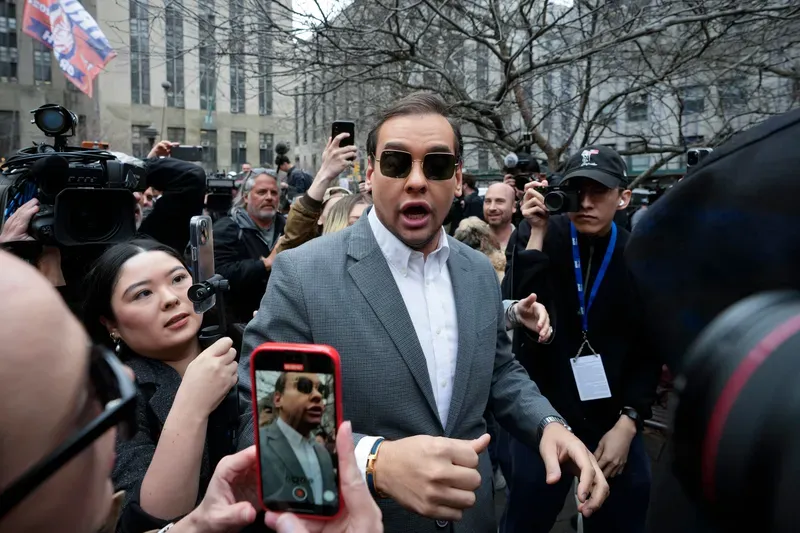 U.S. Rep. George Santos (R-NY) walks through the crowd gathered outside the courthouse on April 4, 2023.