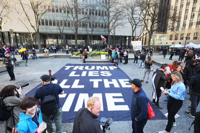 Demonstrators protest against former President Donald Trump at Collect Pond Park near the courthouse ahead of his arraignment hearing on April 04, 2023, in New York City. 
