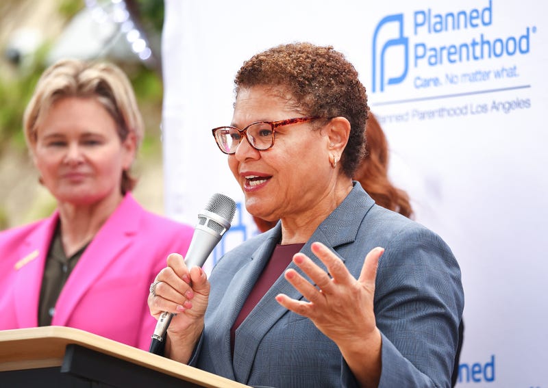 karen bass speaks at podium