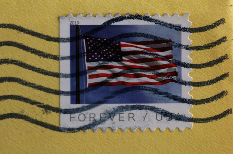 In this photo illustration, a U.S. Postal Service (USPS) forever stamp is seen on an envelope on April 11, 2023 in San Anselmo, California. The USPS is raising the price of a first-class stamp from 63 cents to 66 cents, up 32 percent since 2019 when the price of a stamp was 50 cents. The price increase is set to take effect on July 9 pending approval by the postal regulator. (Photo Illustration by Justin Sullivan/Getty Images)