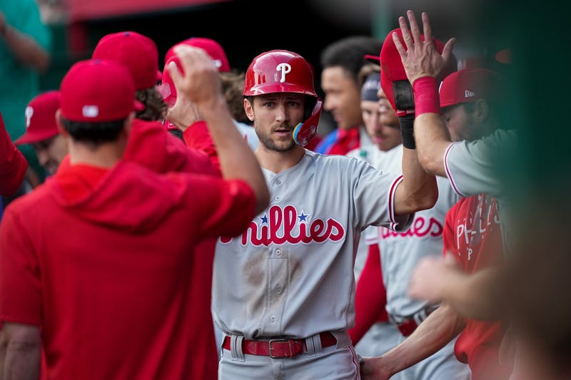 Trea Turner #7 of the Philadelphia Phillies celebrates with teammates after scoring a run in the first inning against the Cincinnati Reds at Great American Ball Park on April 14, 2023 in Cincinnati, Ohio.