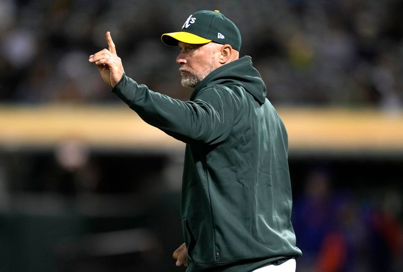 Oakland manager Mark Kotsay makes a pitching change