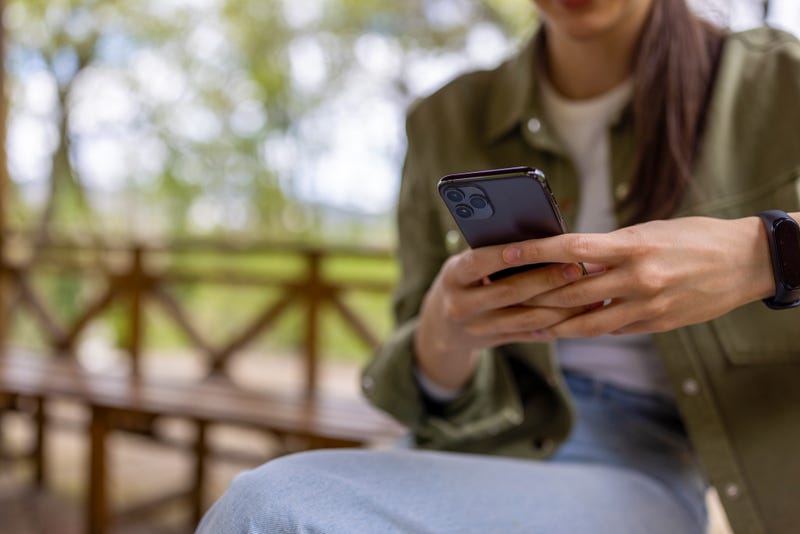 College girl holding phone