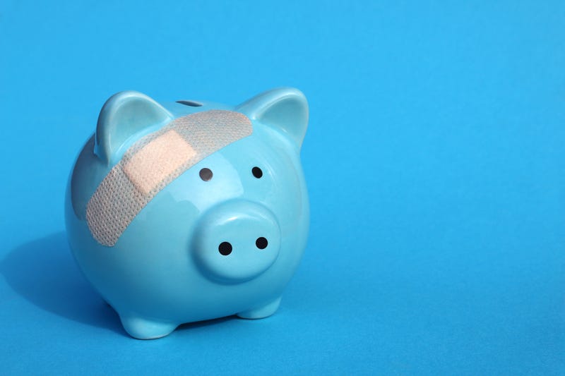 blue piggybank with bandaid.
