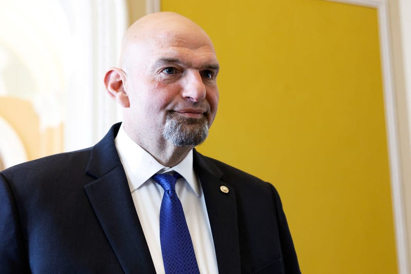 Sen. John Fetterman (D-PA) speaks to reporters on the way to the weekly Senate Policy Luncheons at the U.S. Capitol Building on April 18, 2023 in Washington, DC.