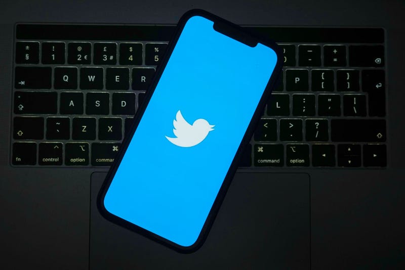 In this photo illustration the Twitter logo can be seen on a mobile phone. 