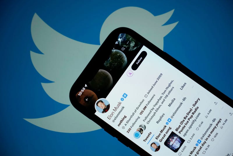 In this photo illustration the Twitter account of Elon Musk is seen on a mobile cellphone on April 21, 2023 in Knutsford, United Kingdom. The social media company started removing large numbers of the blue verification check marks, or "blue ticks," that had historically indicated a verified account. The company said in a statement that they are "removing legacy verified checkmarks" and, to remain verified on Twitter, users can sign up for the paid Twitter Blue subscription. (Photo illustration by Christopher Furlong/Getty Images)