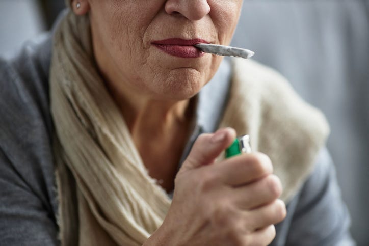 senior smoking a joint