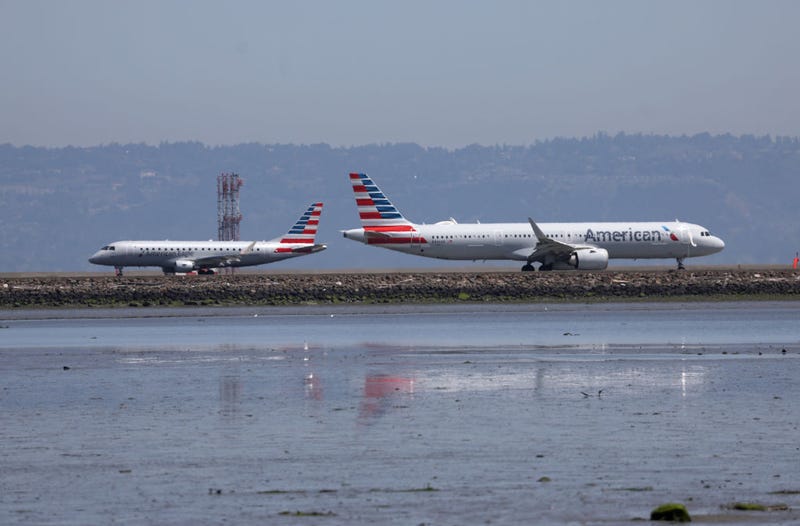 SAN FRANCISCO, CALIFORNIA - APRIL 27: An American Airlines plane prepares to take off past another American Airlines plane on the runway at San Francisco International Airport on April 27, 2023 in San Francisco, California. American Airlines reported better-than-expected first-quarter earnings with a net income of $10 million.