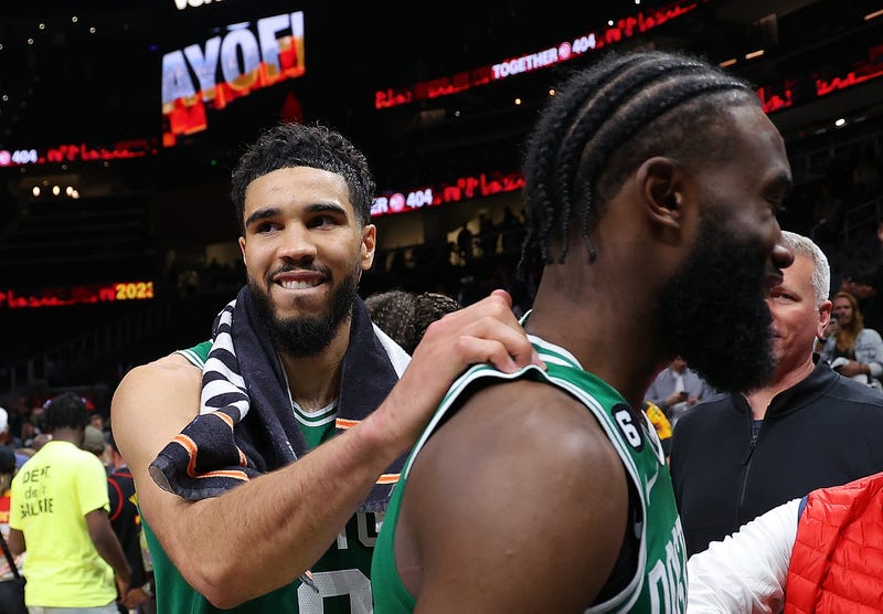  Jayson Tatum #0 of the Boston Celtics celebrates their 128-120 win over the Atlanta Hawks with Jaylen Brown #7 after Game Six of the Eastern Conference First Round Playoffs at State Farm Arena on April 27, 2023 in Atlanta, Georgia.