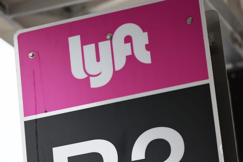 A Lyft sign is seen in the pick-up area at JFK Airport on April 28, 2023, in New York City.