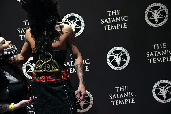 People attend a 'Satanic Ball' at SatanCon on April 28, 2023 in Boston, Massachusetts.