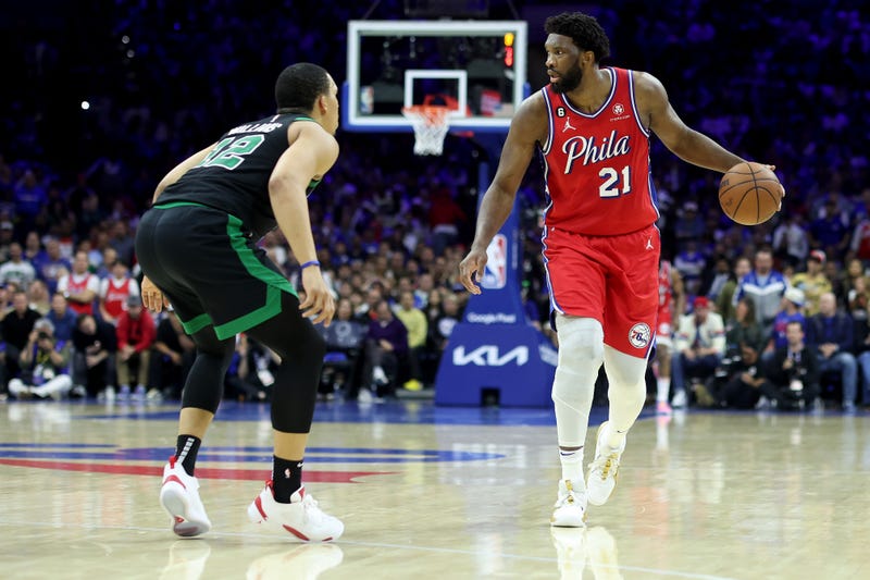 Joel Embiid of the Philadelphia 76ers dribbles against Grant Williams of the Boston Celtics during the fourth quarter in Game 3 of the Eastern Conference Second Round Playoffs at Wells Fargo Center on May 5, 2023, in Philadelphia.