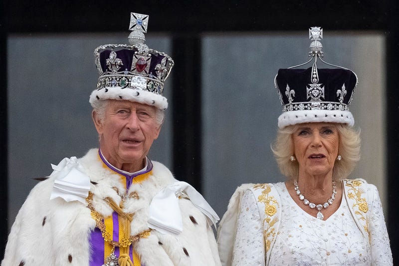 King Charles III and Queen Camilla are seen on the Buckingham Palace balcony during the flypast during the Coronation of King Charles III and Queen Camilla on May 06, 2023 in London, England. The Coronation of Charles III and his wife, Camilla, as King and Queen of the United Kingdom of Great Britain and Northern Ireland, and the other Commonwealth realms takes place at Westminster Abbey today. Charles acceded to the throne on 8 September 2022, upon the death of his mother, Elizabeth II. (Photo by Christopher Furlong/Getty Images)