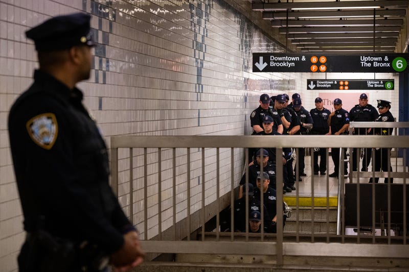 NYPD officers from the Special Response Group (SRG) unit wait inside the Broadway-Lafayette subway station ahead of a "Justice for Jordan Neely" vigil and protest on May 8, 2023