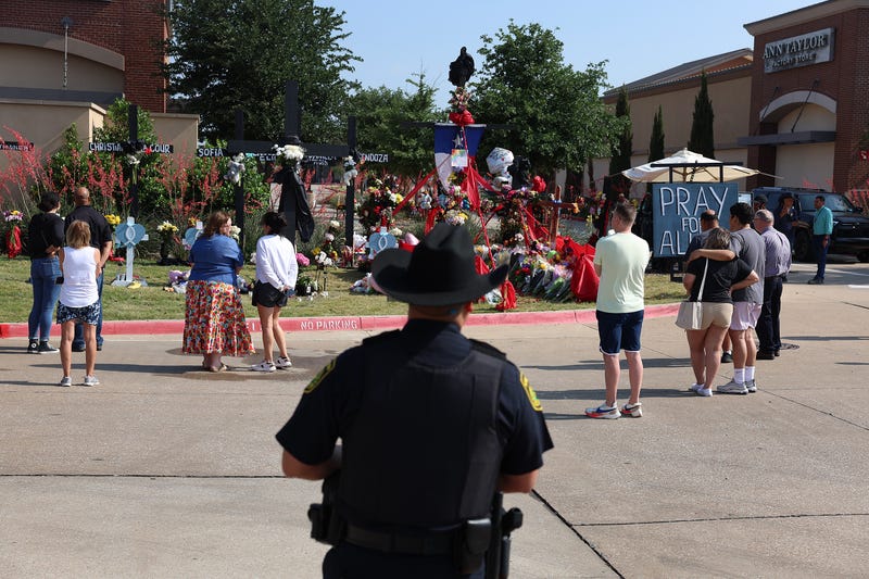 officer looks at memorial