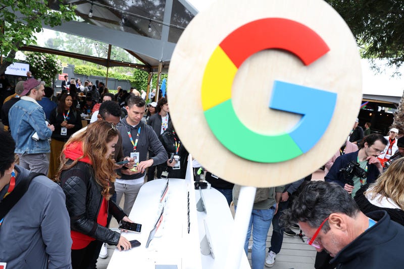 Members of the media inspect the new Google Pixel Foldable phone during the Google I/O developers conference at Shoreline Amphitheatre on May 10, 2023 in Mountain View, California. Google held its annual Google I/O developers conference where they unveiled the new foldable phone. (Photo by Justin Sullivan/Getty Images)