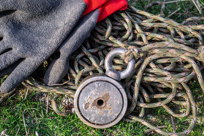 Magnet fishing set on a grass.