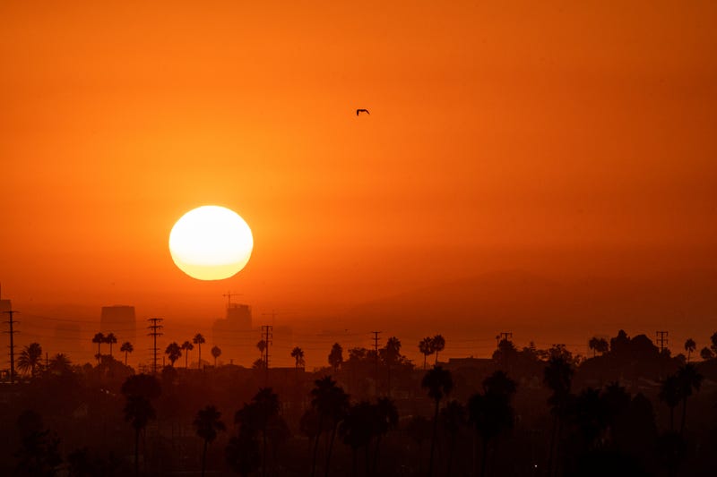 A hot summer sun rises over Los Angeles during the end of summer heatwave