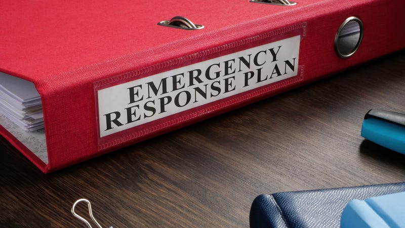 A red folder titled Emergency Response Plan - stock photo