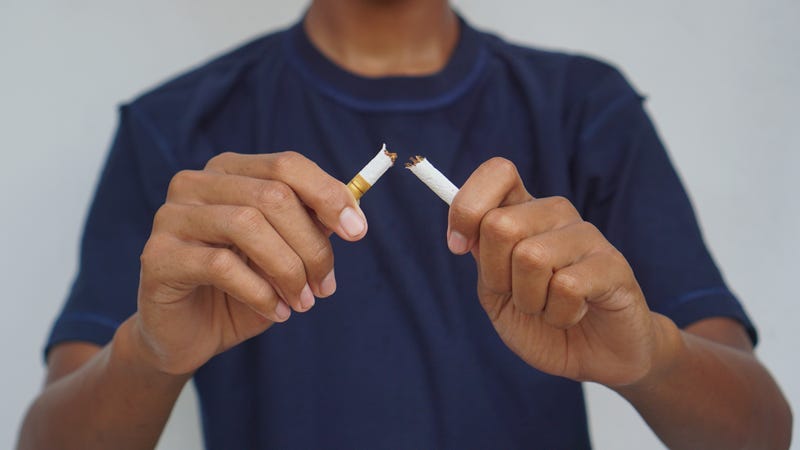 The boy broke cigarette for refusing to smoke. No smoking campaign. Boy refusing cigarette