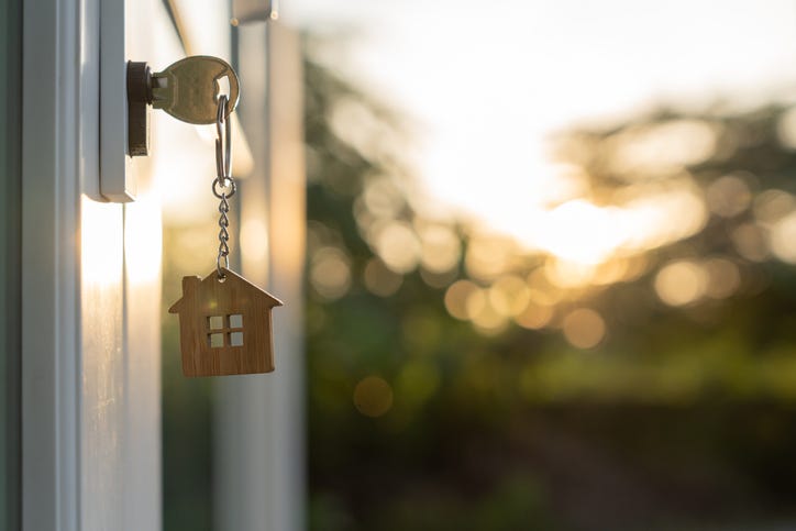 Key in the door to a house. 