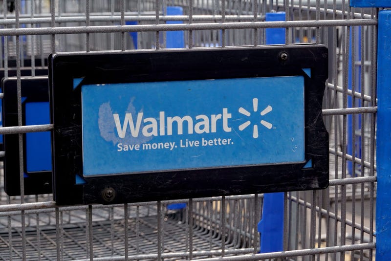 The company logo is shown on the front of shopping cart at a Walmart store on May 18, 2023 in Chicago, Illinois. Walmart, the world's largest retailer, today reported first-quarter same-store sales growth that beat expectations and the company raised its full-year forecast. (Photo by Scott Olson/Getty Images)