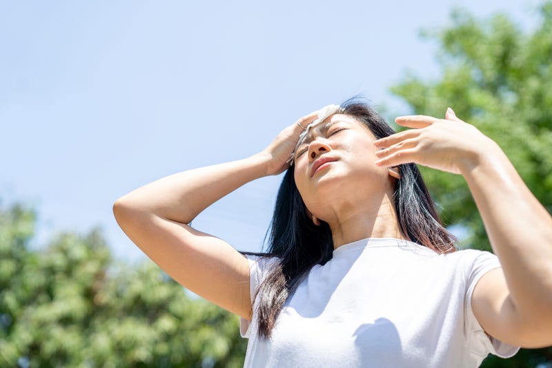 FILE: Woman outside in the heat