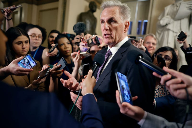 Surrounded by reporters, Speaker of the House Kevin McCarthy (R-CA) stops for what appears to be an impromptu live interview with CNN's Manu Raju in between meetings at the U.S. Capitol on May 22, 2023 in Washington, DC.