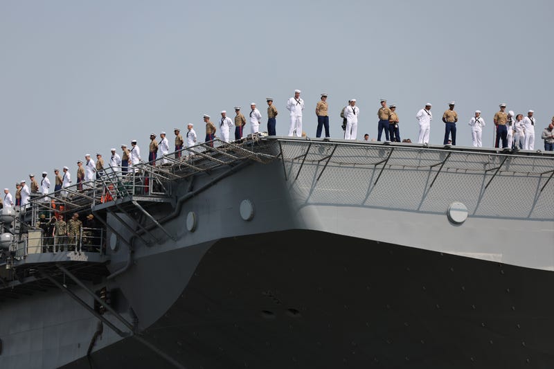 Service men and women stand on deck of the USS Wasp, an amphibious assault ship from Norfolk, Virginia, as it arrives into New York Harbor on Wednesday during the start of the 35th annual Fleet Week on May 24, 2023 in New York City. Nine ships, including one each from Italy, the United Kingdom and Canada paraded into New York Harbor for the start of the annual event which includes public ship tours, ceremonies and naval and military educational events.
