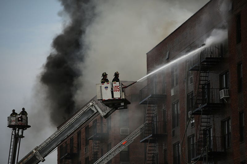 FDNY firefighters extinguishing a fire in Brooklyn. Not the specific fire that killed two sisters in 2021.