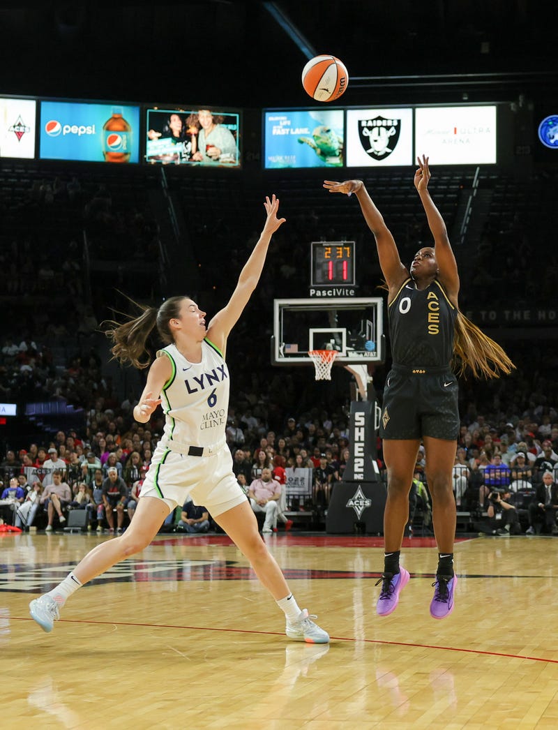 Jackie Young #0 of the Las Vegas Aces shoots a 3-pointer against Bridget Carleton #6 of the Minnesota Lynx in the third quarter of their game at Michelob ULTRA Arena on May 28, 2023 in Las Vegas, Nevada.