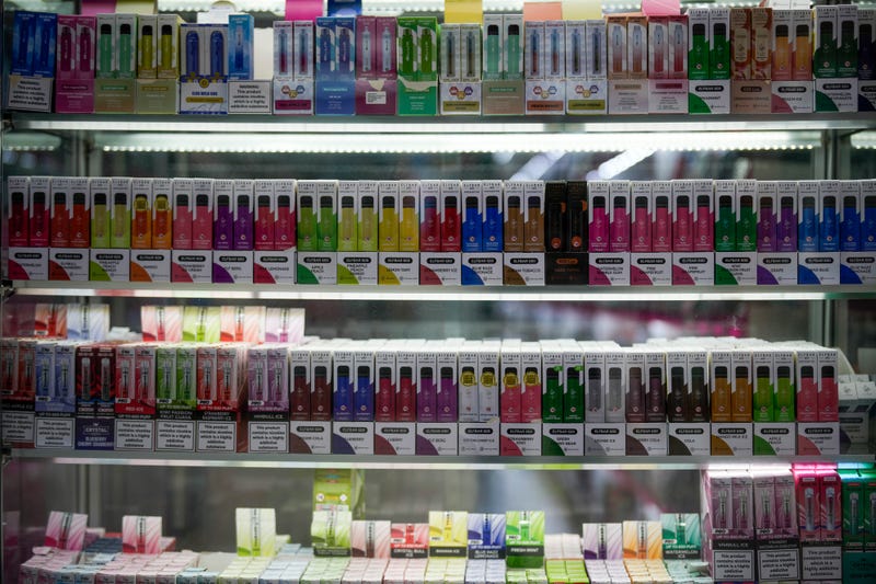 Disposable vaping devices are seen for sale in a shop.
