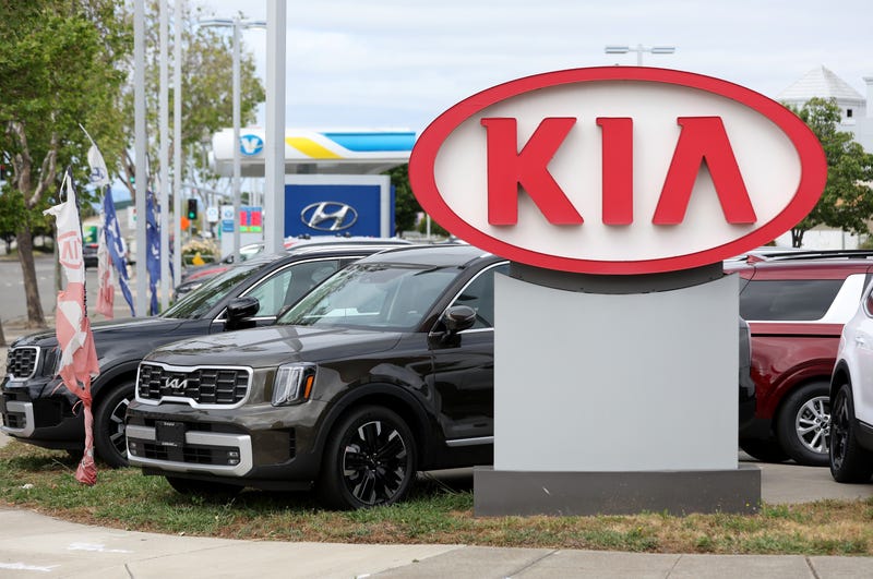 New Kia cars are displayed on a sales lot in California on May 30, 2023.