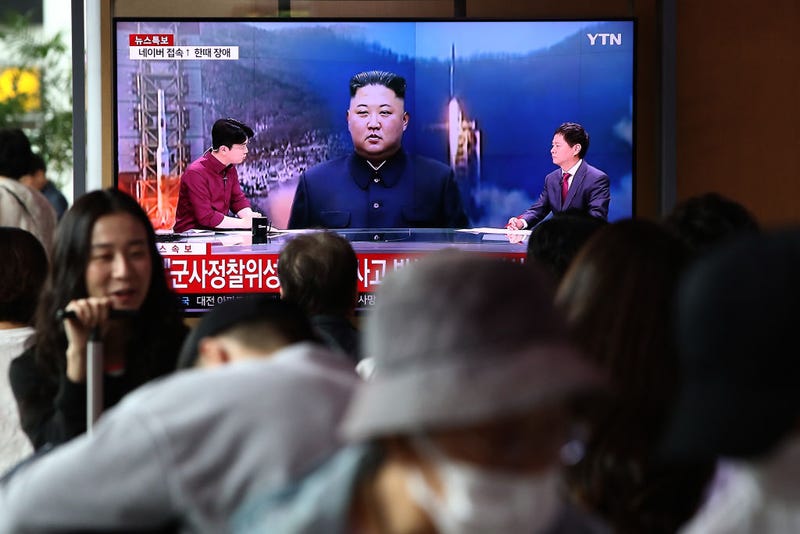 People watch a television broadcast showing a file image of a North Korean leader Kim Jong-Un at the Seoul Railway Station on May 31, 2023 in Seoul, South Korea.