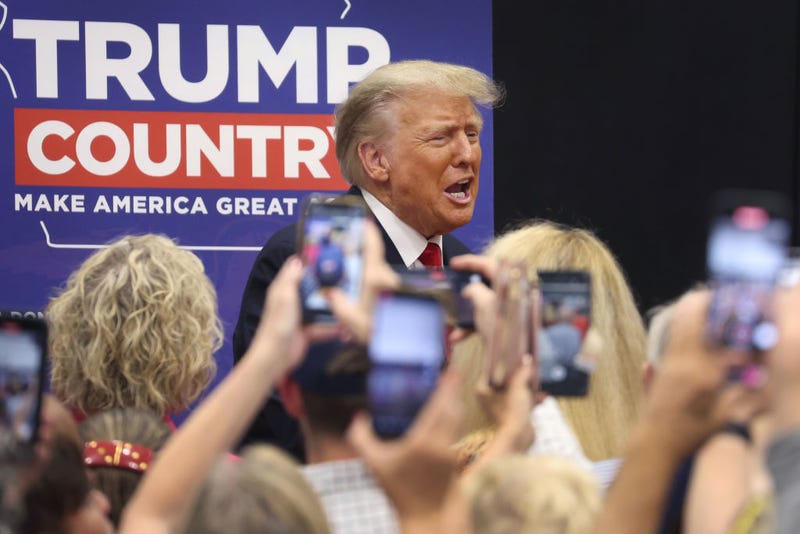 Former President Donald Trump greets supporters at a Team Trump volunteer leadership training event held at the Grimes Community Complex on June 01, 2023 in Grimes, Iowa. Trump delivered an unscripted speech to the crowd at the event before taking several questions from his supporters. (Photo by Scott Olson/Getty Images)