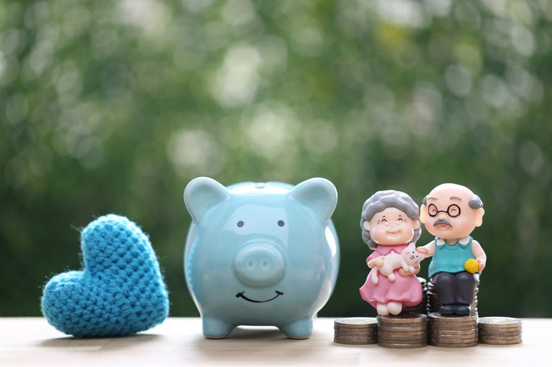 A retired couple and a piggy bank. 
