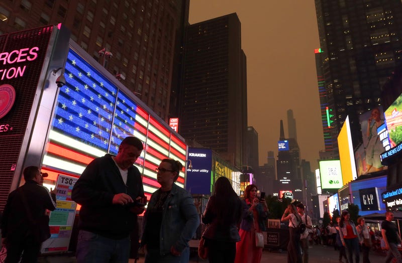 Heavy smoke shrouds buildings in Times Square as the sun sets on June 6, 2023, in New York City