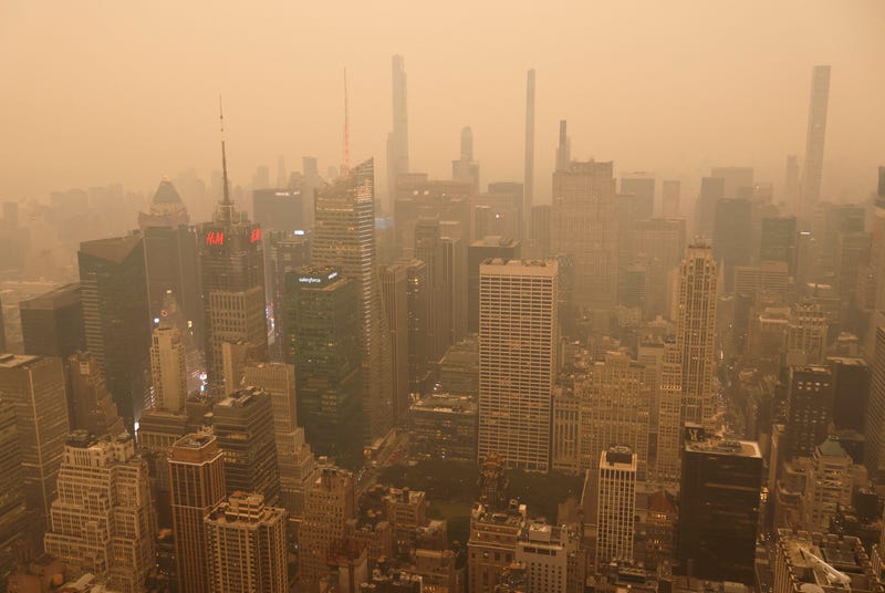 Heavy smoke shrouds buildings around Times Square in a view looking north from the Empire State Building as the sun sets on June 6, 2023, in New York City