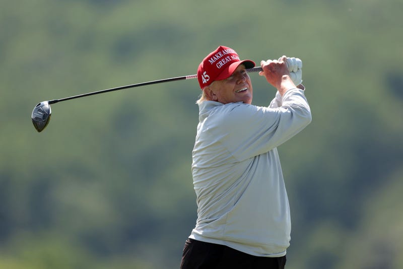 Former US President Donald Trump plays a tee shot during the pro-am prior to the LIV Golf Invitational - DC at Trump National Golf Club on May 25, 2023 in Sterling, Virginia. (Photo by Rob Carr/Getty Images)